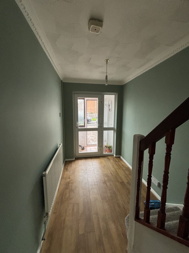 Staircase wall painting project in Southampton with smooth finish and clean lines