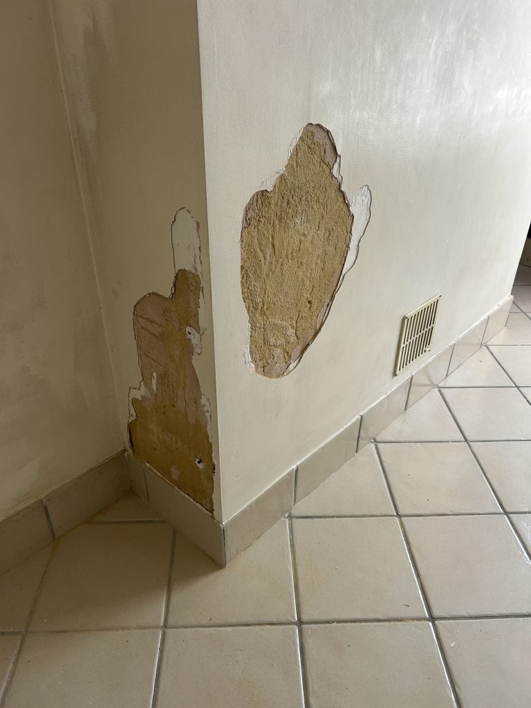 Wall repair and surface preparation before painting in Southampton home