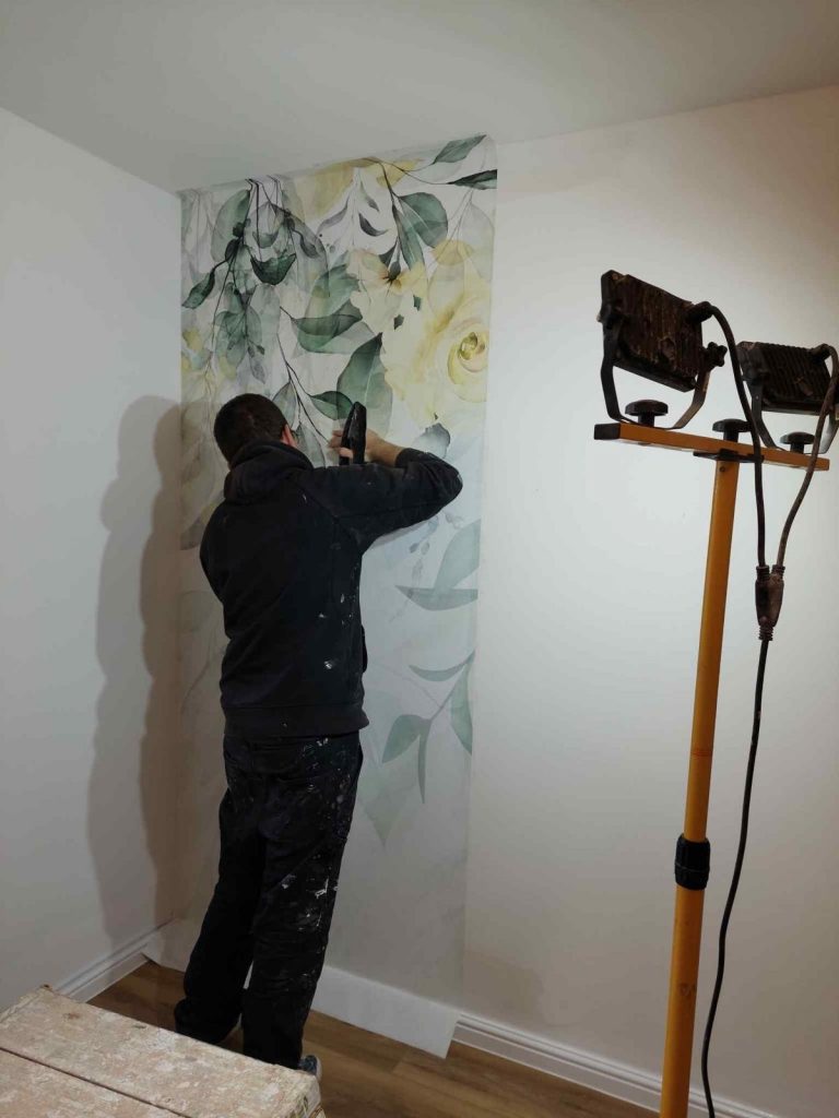 Wallpapering in progress in Southampton showing careful application and alignment