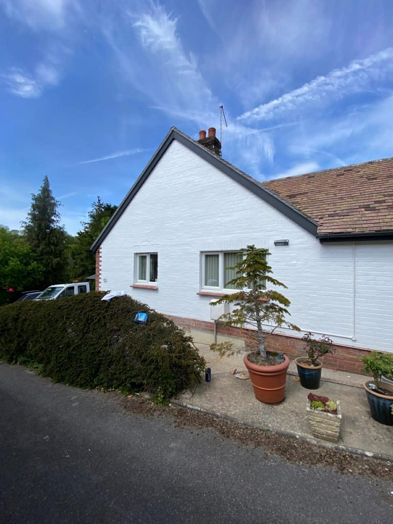 Freshly painted house exterior in Southampton with bright white masonry finish