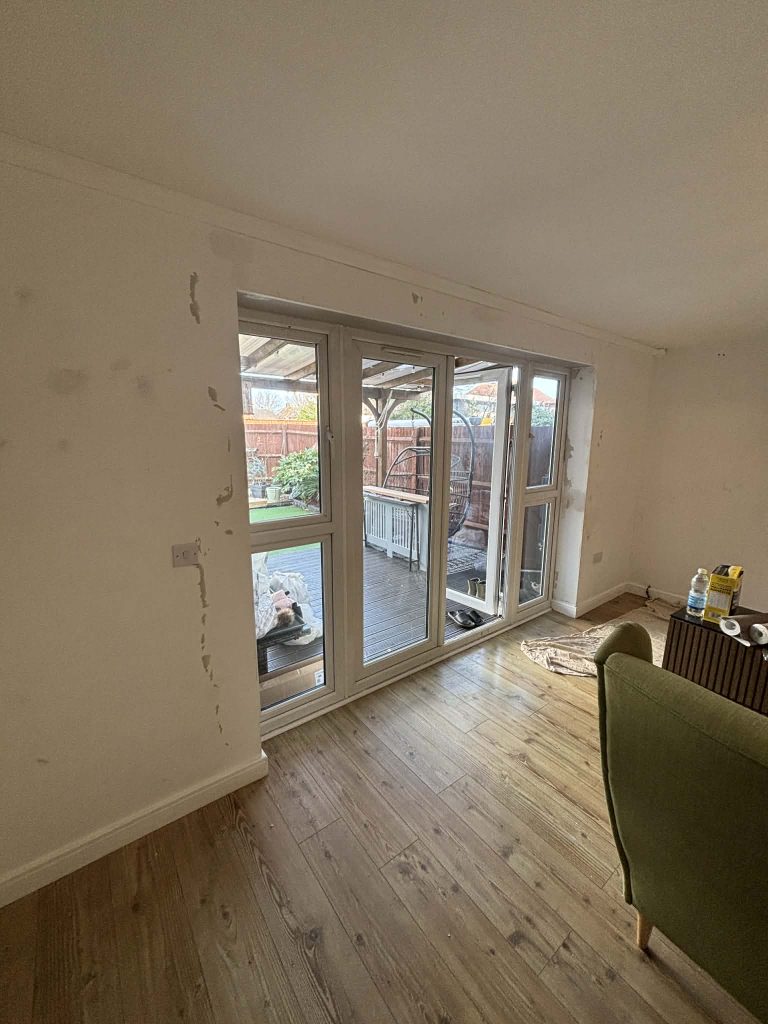 Room prepared for wallpaper installation in Southampton with clean walls and setup