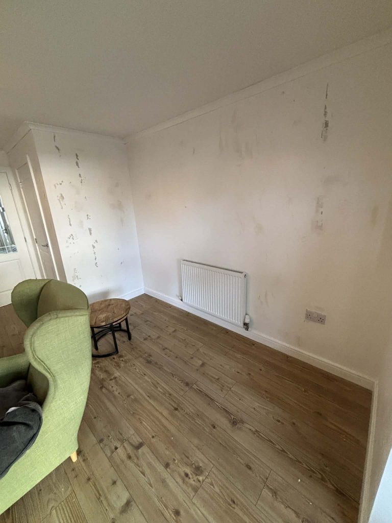 Interior wall repairs and surface preparation prior to wallpapering
