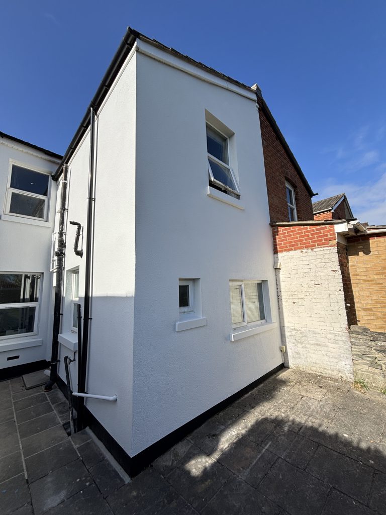 After exterior house painting in Southampton with clean white finish and repaired surfaces