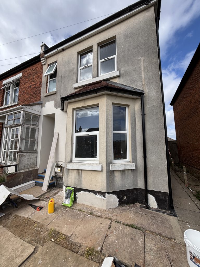 Damaged exterior walls before repair and painting in Southampton property