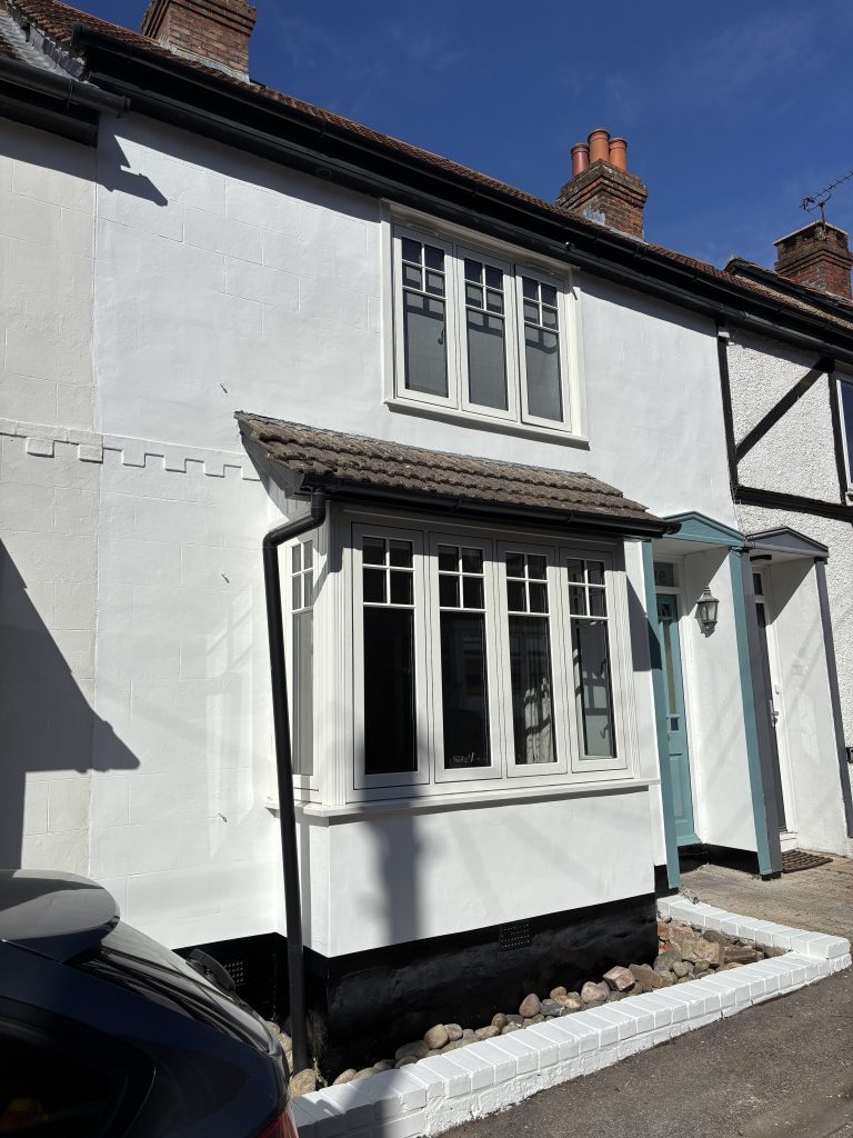 Freshly painted house exterior in Southampton with smooth white masonry finish