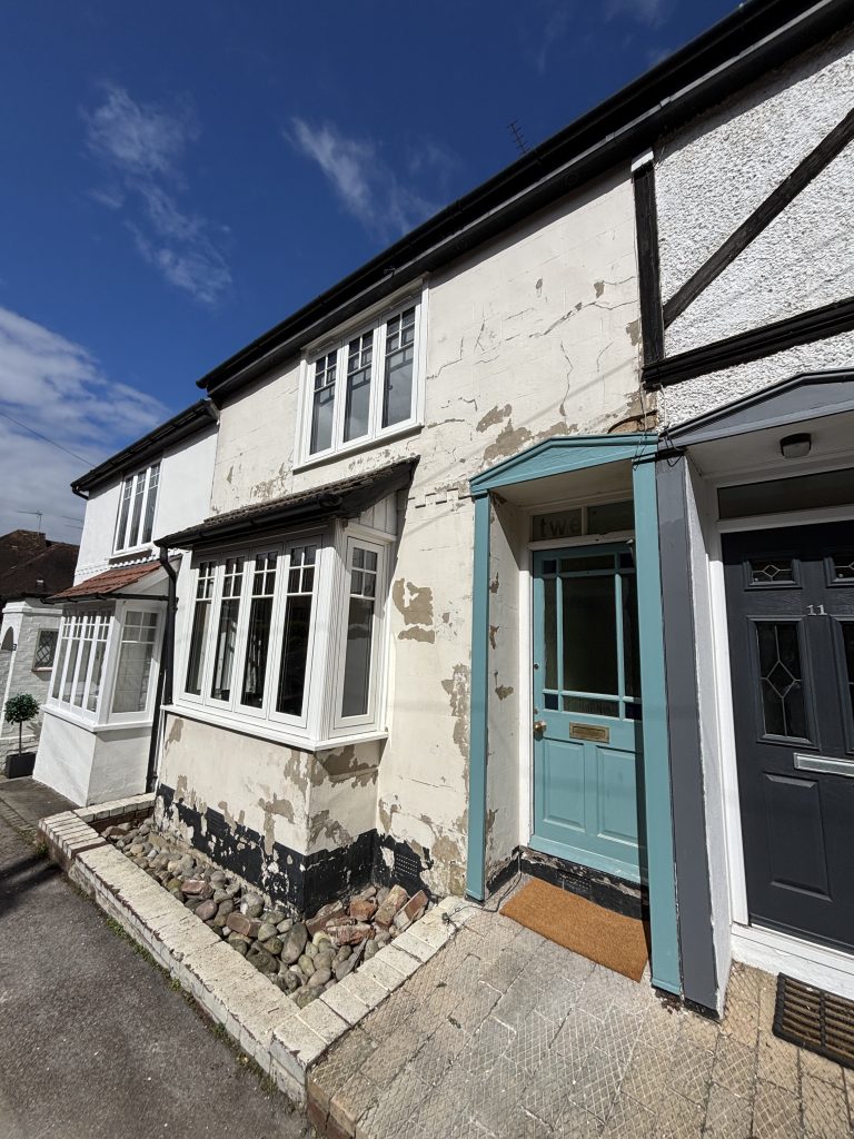 Before exterior house painting in Southampton showing peeling paint and damaged walls