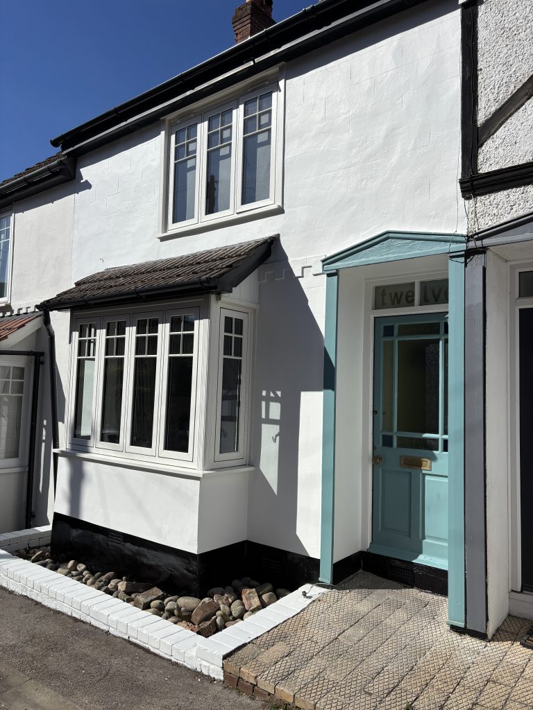 After exterior house painting in Southampton with clean white finish and repaired surfaces