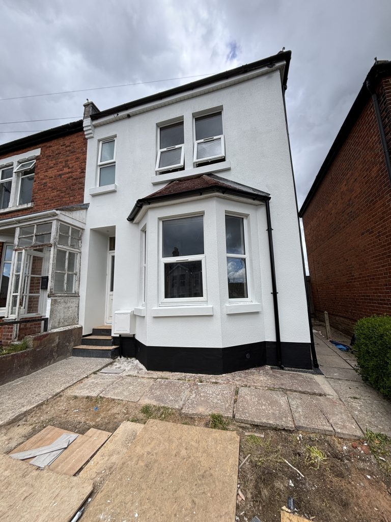 Freshly painted house exterior in Southampton with smooth white masonry finish