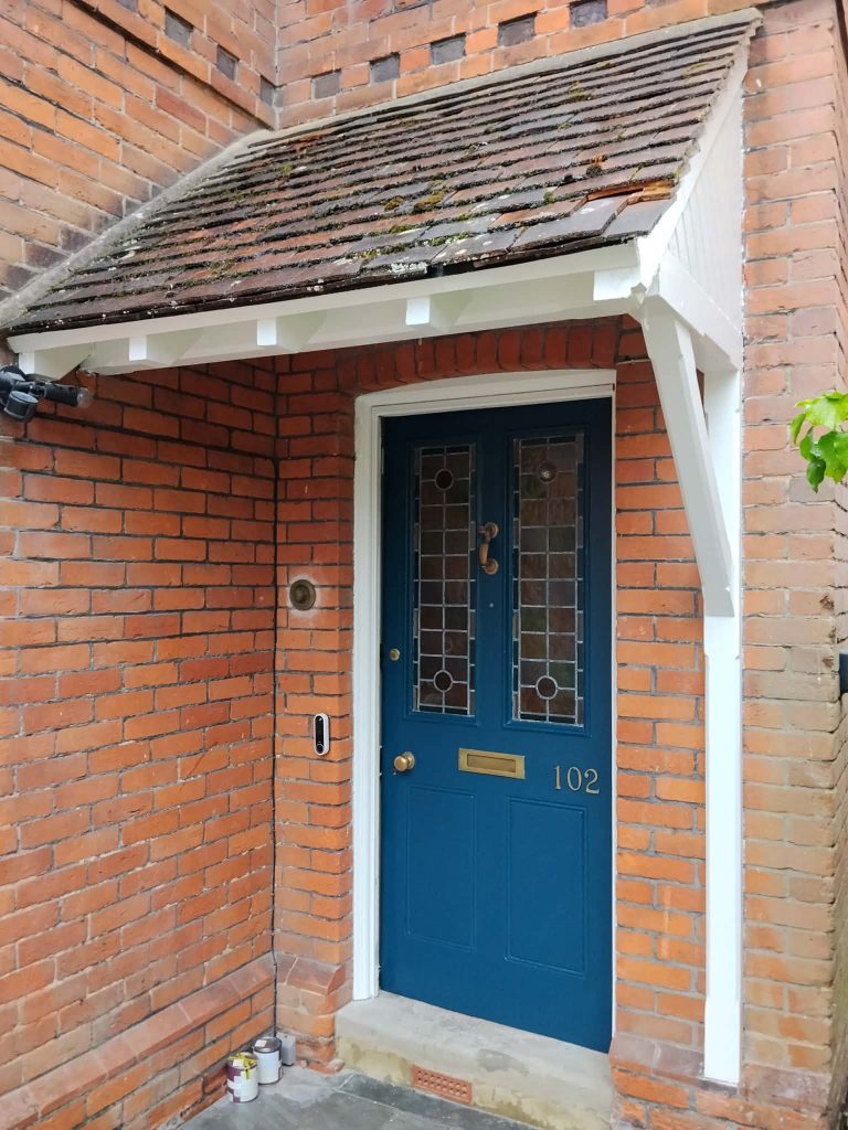 Front door painting completed in Southampton with restored porch woodwork and freshly painted exterior timber.