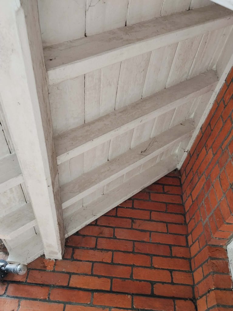 Porch soffit and timber ceiling before exterior painting and woodwork restoration in Southampton.
