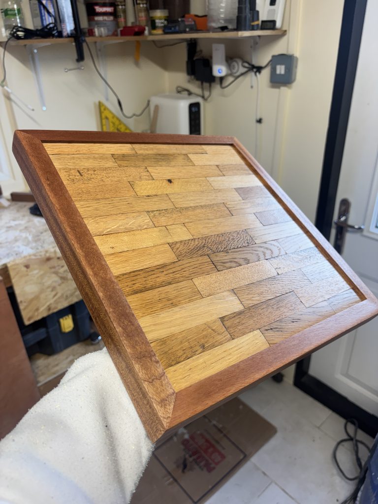 Applying finish to a handcrafted reclaimed oak clock
