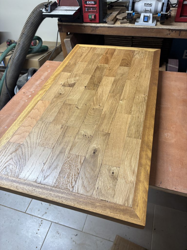 Finished reclaimed oak coffee table top in the workshop